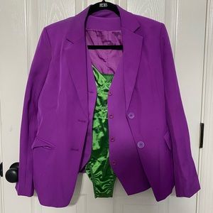 Purple woman’s pant suit. Comes with pants, jacket, vest, and green body suit.